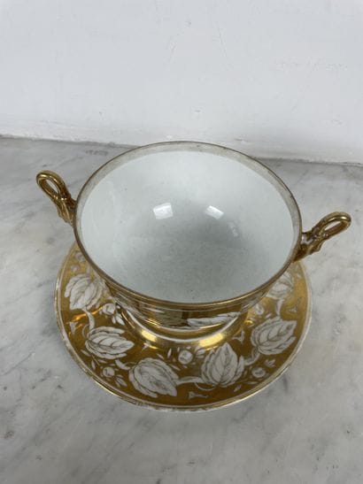 Porcelain two-handled bouillon cup and display...