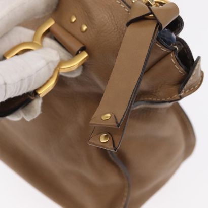 Chloé Marcie Satchel
Studded leather handbag,...