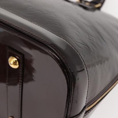 Louis Vuitton Alma Handbag
Monogram patent...