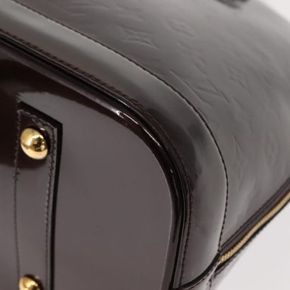 Louis Vuitton Alma Handbag
Monogram patent...
