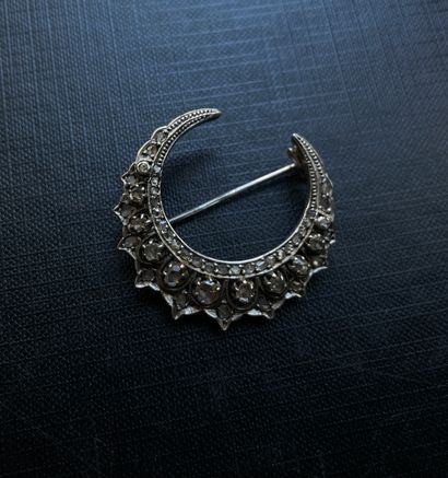 Silver and 18K gold crescent moon brooch...