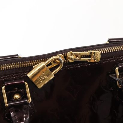 Louis Vuitton Alma Handbag
Monogram patent...