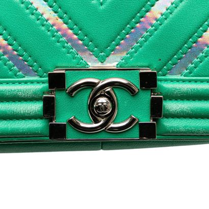 Chanel Boy Flap Bag
Herringbone leather shoulder...