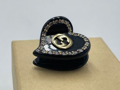 Gucci Interlocking G Heart Hair Clip
Plastic...