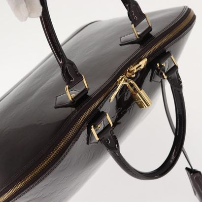 Louis Vuitton Alma Handbag
Monogram patent...