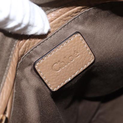 Chloé Marcie Satchel
Studded leather handbag,...