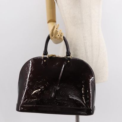 Louis Vuitton Alma Handbag
Monogram patent...