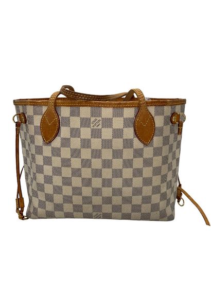 Louis Vuitton Neverfull Tote
Sac cabas en...