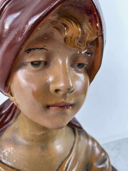 Female bust in painted terra cotta, representing...