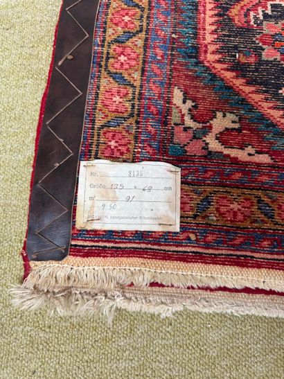 Wool carpet with stylized floral decoration,...