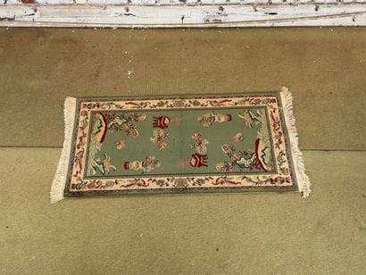 Chinese-style hallway rug with floral vase...
