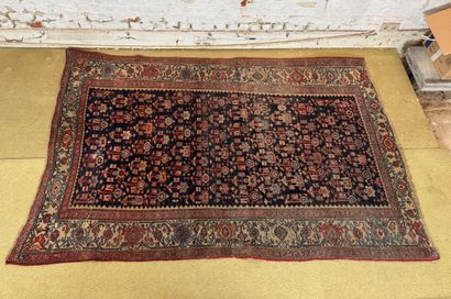 Geometrically decorated wool carpet in the...