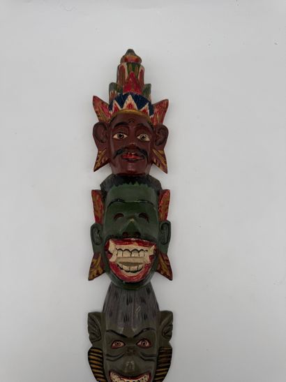 Carved wood wall totem with mask decoration
Carved...