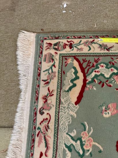 Chinese-style hallway rug with floral vase...