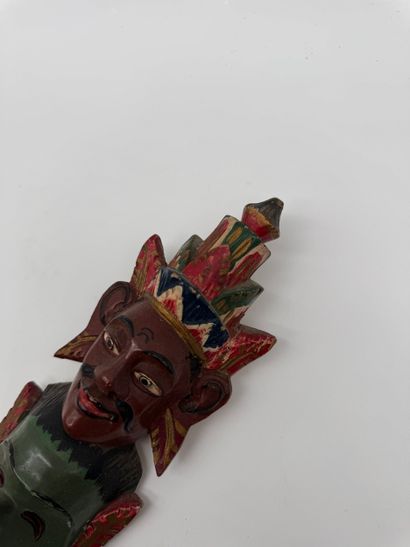 Carved wood wall totem with mask decoration
Carved...