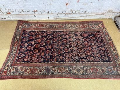 Geometrically decorated wool carpet in the...