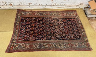 Geometrically decorated wool carpet in the...