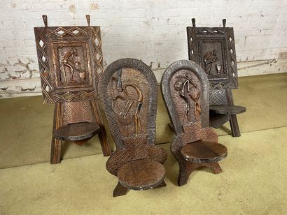 Lot de 4 sièges africains sculptés en bois...