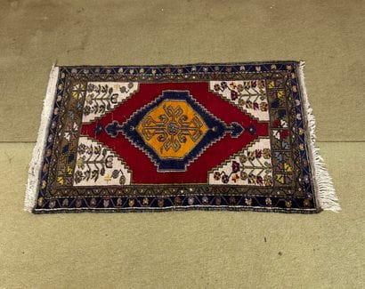 Wool carpet with geometric and stylized floral...