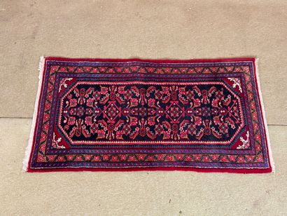 Wool carpet with stylized floral decoration,...