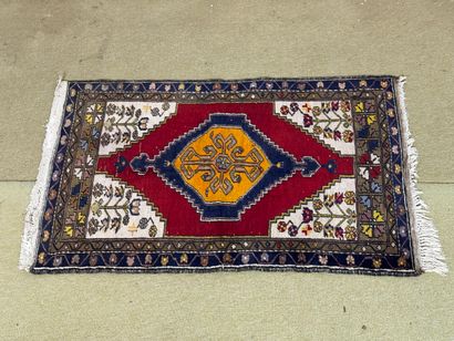 Wool carpet with geometric and stylized floral...