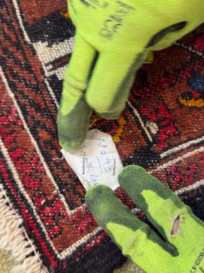 Small Caucasian rug with geometric and animal...
