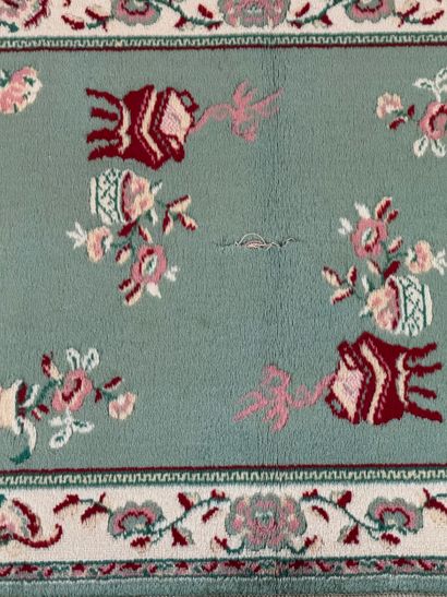Chinese-style hallway rug with floral vase...