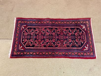 Wool carpet with stylized floral decoration,...
