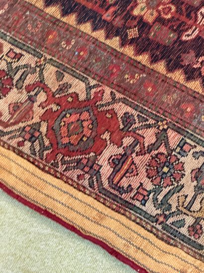 Geometrically decorated wool carpet in the...