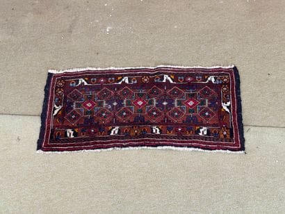 Small Caucasian rug with geometric and animal...