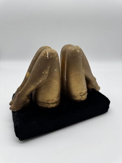 Pair of bookends featuring feminine legs...