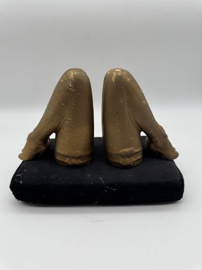 Pair of bookends featuring feminine legs...