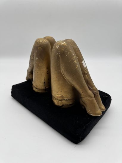 Pair of bookends featuring feminine legs...