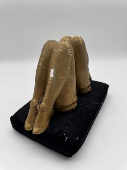 Pair of bookends featuring feminine legs...