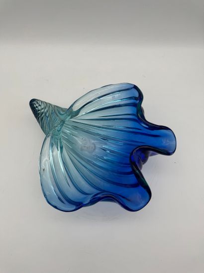 Blue glass basket in the shape of a shell...