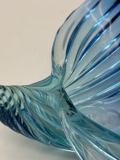 Blue glass basket in the shape of a shell...