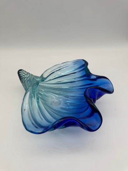 Blue glass basket in the shape of a shell...