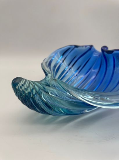 Blue glass basket in the shape of a shell...