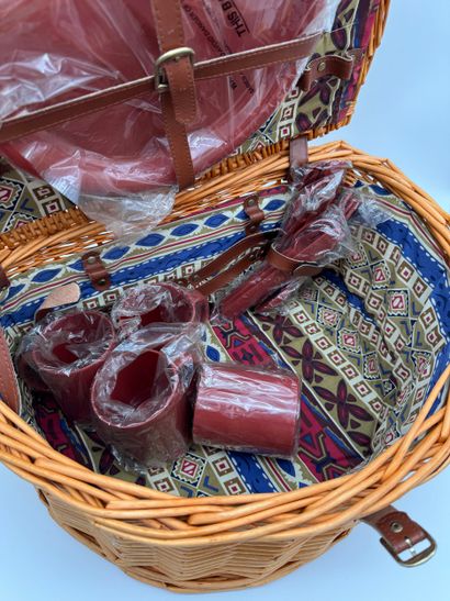 Picnic-style wicker basket with garnish
Picnic-style...