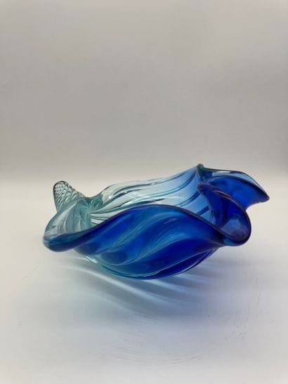 Blue glass basket in the shape of a shell...