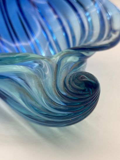 Blue glass basket in the shape of a shell...