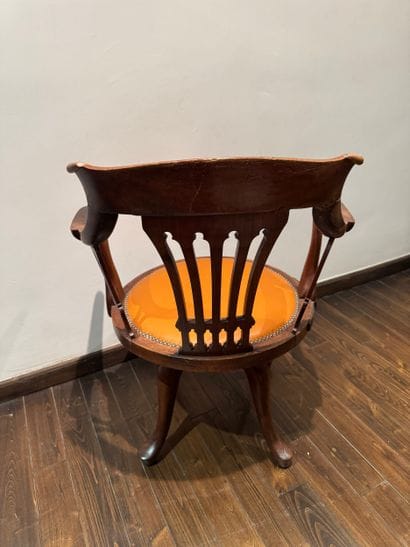 Swivel office chair with openwork backrest,...