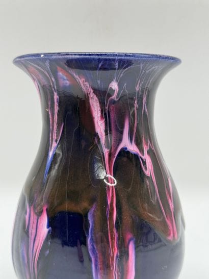Glazed ceramic vase with flowing decoration
Baluster-shaped...