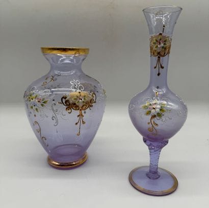 Two violet-colored glass vases decorated...