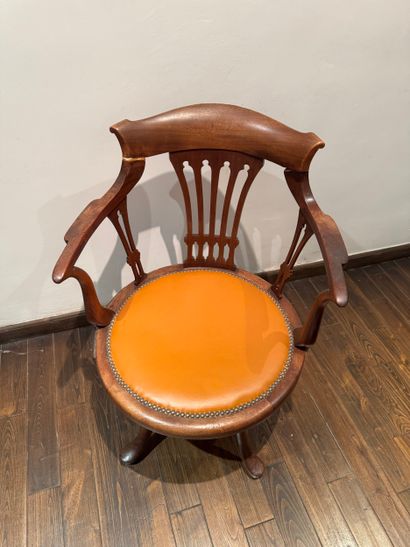 Swivel office chair with openwork backrest,...