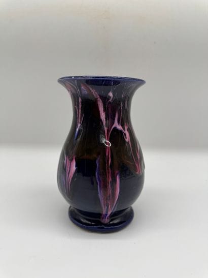 Glazed ceramic vase with flowing decoration
Baluster-shaped...
