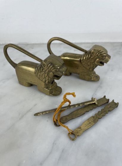 Pair of bronze lion-shaped padlocks with...