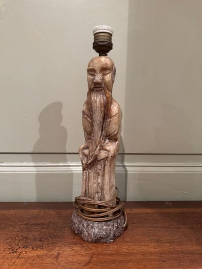 Carved stone lamp depicting a Chinese sage
Monolithic...