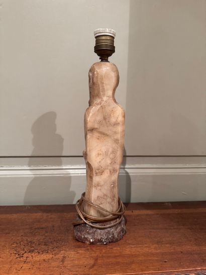 Carved stone lamp depicting a Chinese sage
Monolithic...