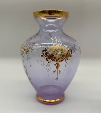 Two violet-colored glass vases decorated...